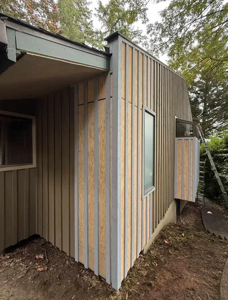 Board and batten siding going on