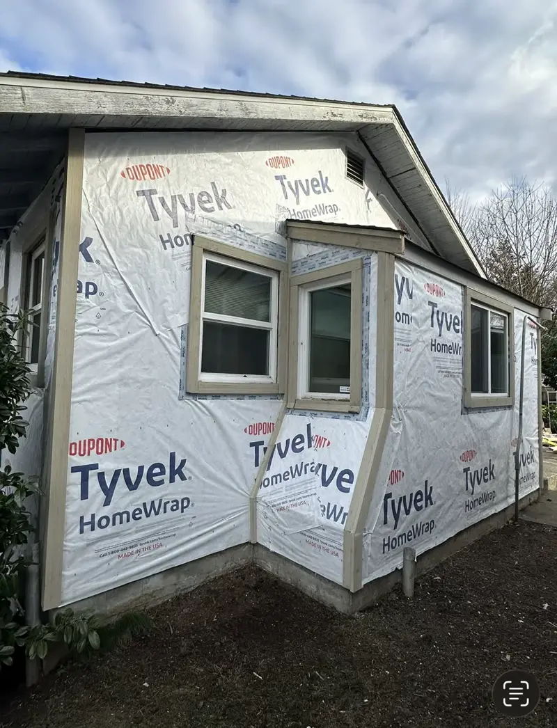 Before: House wrap installed before new siding